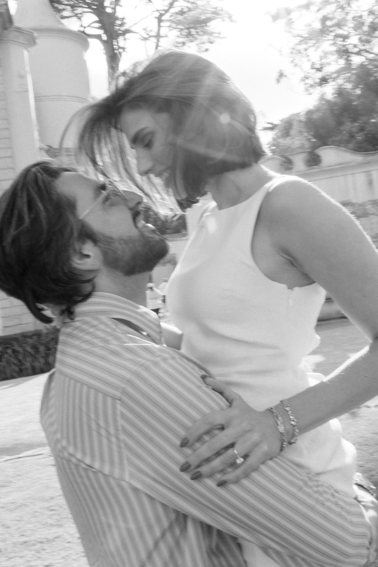 Kayla and Bruno embracing, photographed in black and white
